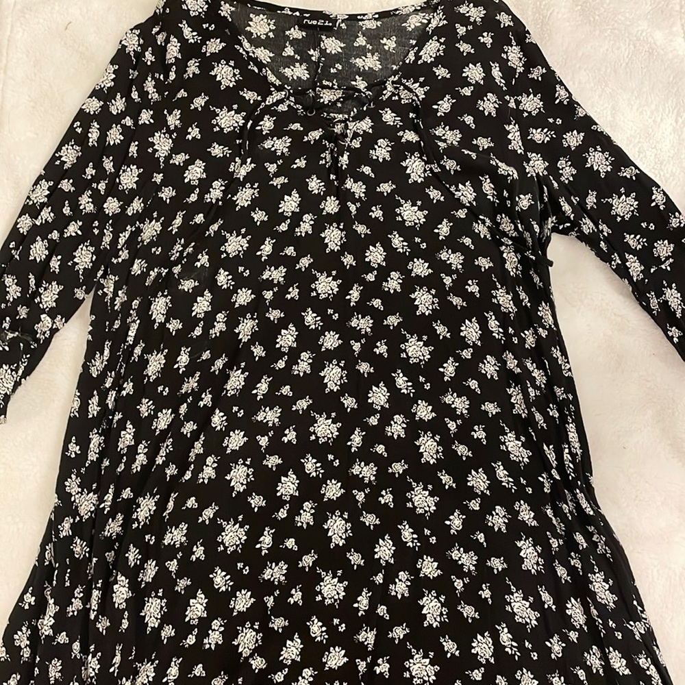 This black dress is from Rue21 size large with white roses on it.